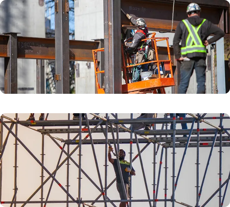 Construction workers installing steel beams and working on scaffolding at an active building site.